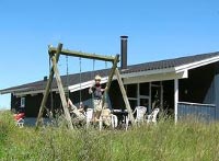 Blaues Holzhaus in Rindby Strand auf Fanø 